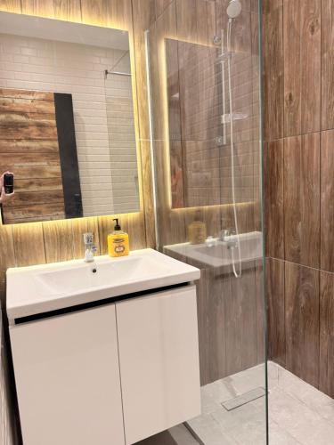 a bathroom with a white sink and a shower at Bohemia palace in Hurghada