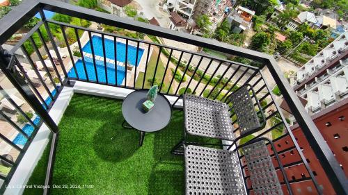 an overhead view of a table and chairs on a balcony at Sky High Suites Royal Ocean Crest Mactan in Lapu Lapu City