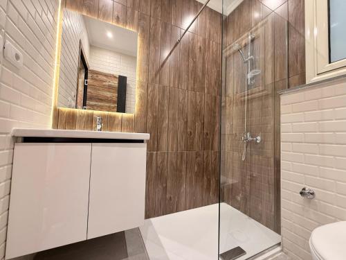 a bathroom with a shower and a sink and a mirror at Bohemia palace in Hurghada