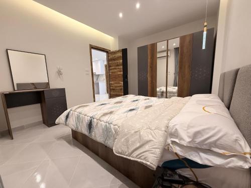 a bedroom with a bed and a television in it at Bohemia palace in Hurghada