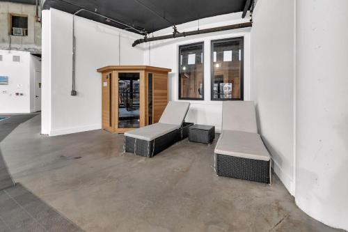 a room with two chairs and a bench and a cabinet at Blue Bliss Indoor Pool, FREE Parking, Near NYC in Elizabeth