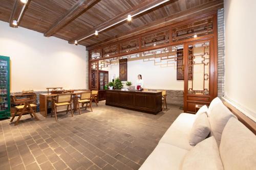 a dining room with a table and chairs at Yangshuo Hidden Dragon Villa in Yangshuo