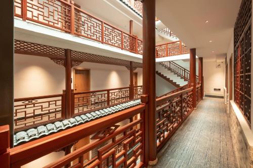 a row of wine racks in a wine cellar at Yangshuo Hidden Dragon Villa in Yangshuo