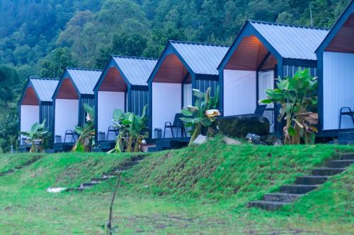 a row of houses on top of a hill at Royal Indah Glamping Kintamani in Kintamani