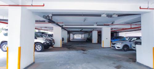a parking garage with cars parked in it at The Hills View in Nairobi