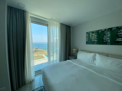 Postel nebo postele na pokoji v ubytování Sea-View Residence