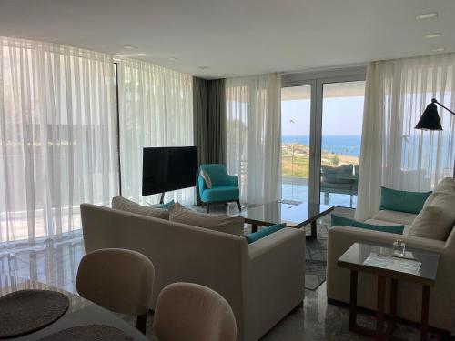 TV a/nebo společenská místnost v ubytování Sea-View Residence