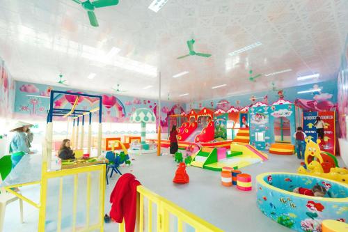 a childrens play room with many toys in it at HDT Farm Stay Thanh Chuong in Thái Nhã