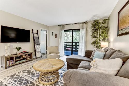 a living room with a couch and a table at 3E Amelia Landings condo in Fernandina Beach