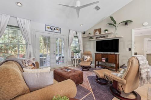 a living room with a couch and a tv at 4937 Windward Place home in Fernandina Beach