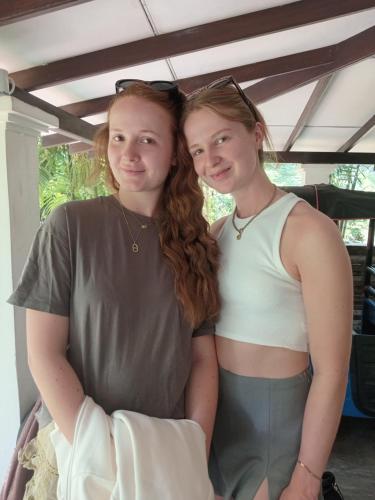 two girls are standing next to each other at Charming dark lodge in river in Weligama
