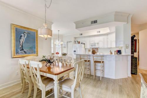 a kitchen and dining room with a table and chairs at Ocean Place Condo in Amelia Island