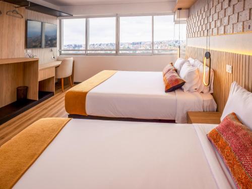 Postel nebo postele na pokoji v ubytování Le Foyer Flats Sudamerica Rooms