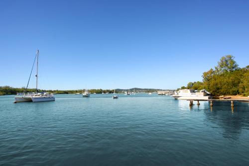 a large body of water with boats in it at Cayman Quays in Noosaville