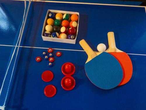 a blue table with billiard balls and a box of balls at Elle's Garden House in Nasushiobara