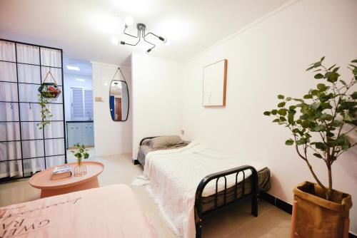 Postel nebo postele na pokoji v ubytování Lin Jiang Apartment