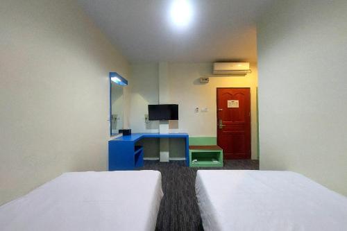 Ένα ή περισσότερα κρεβάτια σε δωμάτιο στο D'merlion Hotel Batam