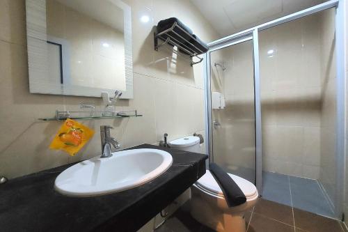 Ένα μπάνιο στο D'merlion Hotel Batam