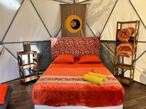 a bedroom with a bed in a tent at Bubble Dome Village in Saint-Joseph