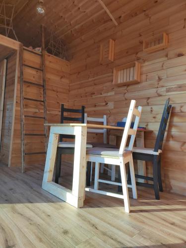 a table and two chairs in a cabin at Slovácká maringotka in Šumice