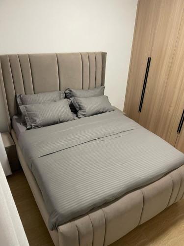 a large bed with pillows on it in a room at New Dawn Home in Ruaka