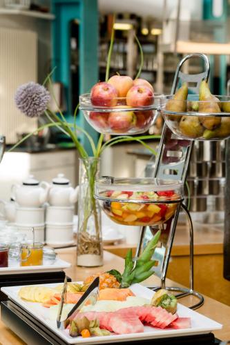 a table with two plates of food on top at Hotel Alte Werft in Papenburg