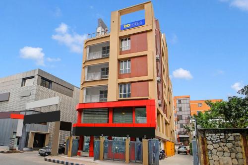 a tall building with a sign on the side of it at FabHotel Lake View Topsia in Kolkata