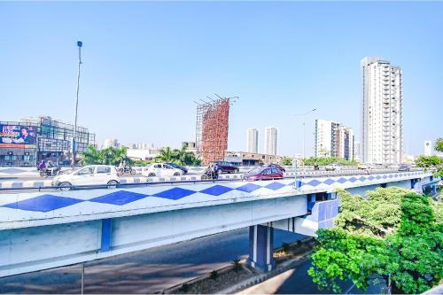 a bridge with cars on it in a city at FabHotel Lake View Topsia in Kolkata