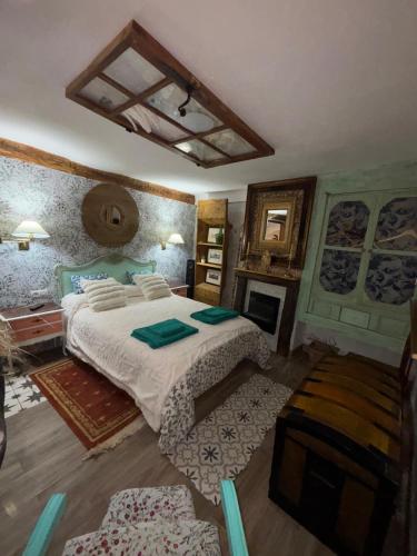 a bedroom with a large bed in a room at Casa rural en Buendía -la Galera con 4 dormitorios in Buendía