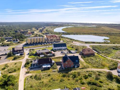 an aerial view of a small town with a lake at 4 star holiday home in Nørre Nebel in Nørre Nebel