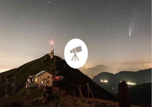 a view of a hill with a sign on it at night at Loggia di charme in Malcantone in Curio