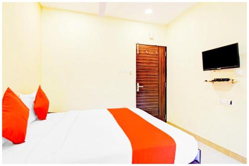 a bedroom with a bed and a tv on the wall at HOTEL SUPERIOR ELITE INN Best HOTEL IN KOLKATA in Belgachia