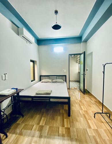 Кровать или кровати в номере Cối Xay Gió Homestay Quảng Bình