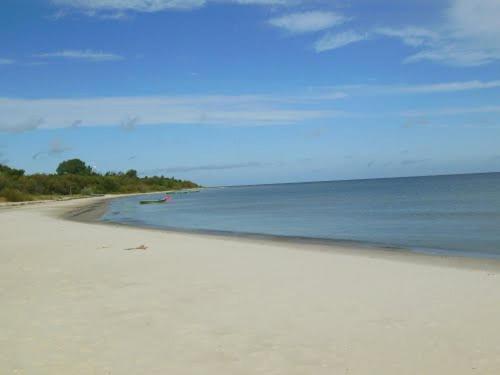 a view of a beach with the ocean and sky at Saulesdarzs in Ragaciems