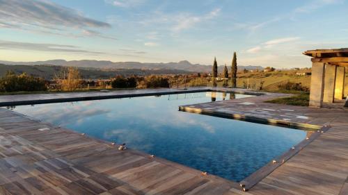 a swimming pool with a view of the mountains at Villa Vernaschi in Santa Maria Nuova