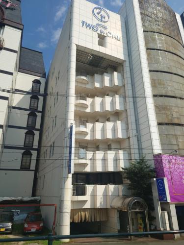 a building with a sign on the side of it at HOTEL TWO in ONE Hiroshima-AdultOnly in Hiroshima