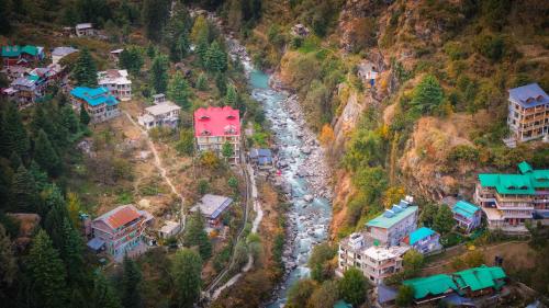 an aerial view of a river in a mountain at The Himalayan Stories - A Riverside Heaven Resort in Vashisht