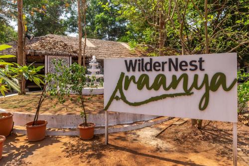 a sign that reads wildest naamuna in front of a house at WilderNest Araanya by Vibescapes in Karjat