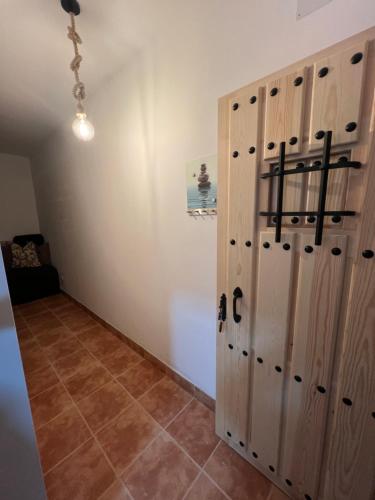 a room with wooden lockers on a wall at Casa Liam in Ceuta