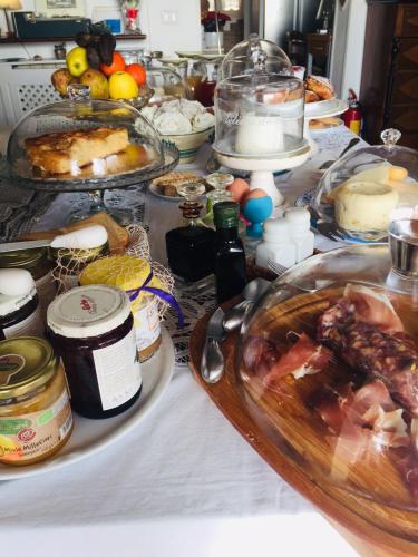 a table with many different types of food on it at Casa tipica siciliana patronale home BedandBreakfast TreMetriSoprailCielo Camere con vista, colazione interna in terrazzo panoramico in Caltagirone