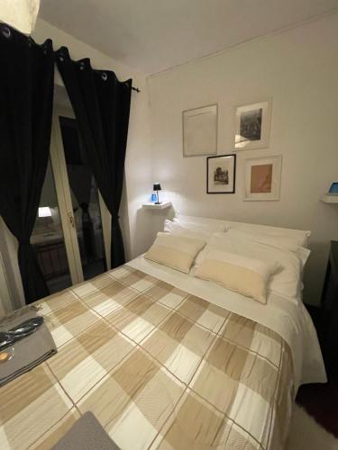 a bedroom with a large bed in a room at Casa tipica siciliana patronale home BedandBreakfast TreMetriSoprailCielo Camere con vista, colazione interna in terrazzo panoramico in Caltagirone