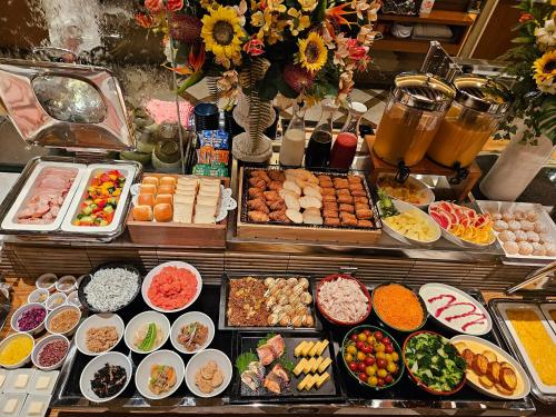 a buffet with many different types of food and drinks at Hearton Hotel Kita Umeda in Osaka
