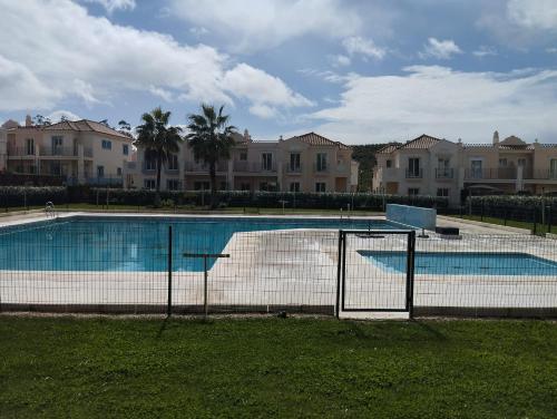 a large swimming pool in front of some houses at Vista Hermosa in Ayamonte