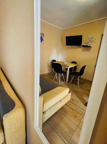 a room with a table and a dining room at Bükk-Völgye Apartman in Bogács
