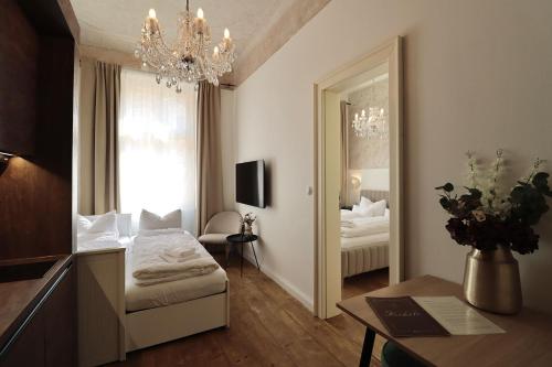 Postel nebo postele na pokoji v ubytování Apartmá Hilda 1905