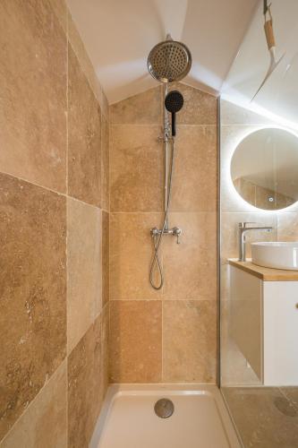 a bathroom with a shower and a sink at La Bergerie des Cimes in Lantosque