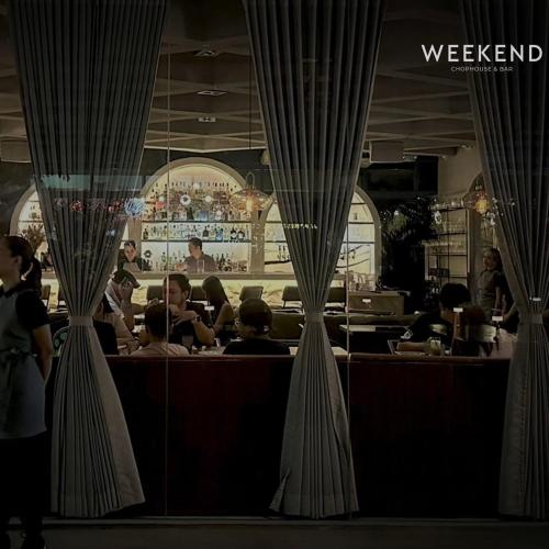 a restaurant with people sitting at a bar at 88th Avenue in Cebu City