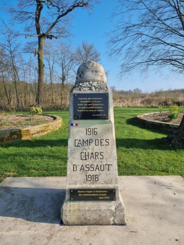 a monument in a park with a sign on it at Gîte du Grand frêne in Orrouy