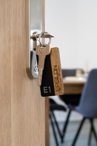 a padlock on a door with a desk at Epsilon Premium Studios in Ermoupoli