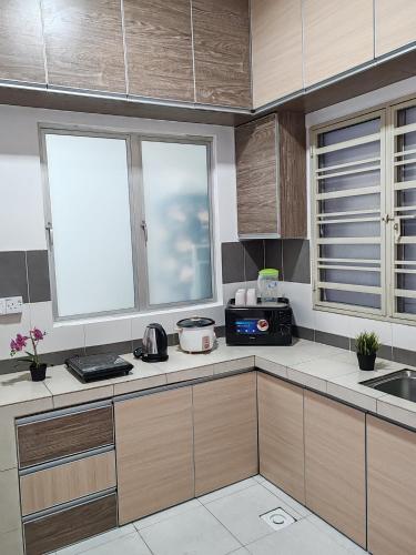 Η κουζίνα ή μικρή κουζίνα στο ZE VI Homestay,Tanah Rata